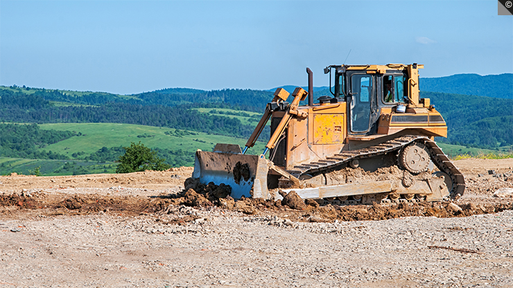 Un angledozer ou bouteur